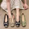 Zapatos individuales de punta redonda a juego de colores nuevos 2025 con lazo retro estilo nacional de boca baja suela blanda zapatos de ballet zapatos planos individuales para mujer