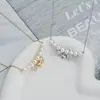 Outono e Inverno nova corrente de clavícula elegante banhada a ouro real com zircônia incrustada design de nicho feminino pingente de coração colar de pérolas