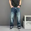 Jeans rectos de estilo minimalista relajado en color azul para hombre, primavera y otoño, con un diseño holgado, casual y de pierna ancha, modernos y versátiles para mujer