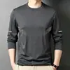 Camiseta de manga larga para hombre de color liso Sorona, versátil, corte holgado, cuello redondo, para primavera y otoño, top casual moderno