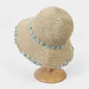 Sombrero de estilo pastoral de verano con ala hueca tejida con pequeñas flores, sombrero de paja Mori, sombrilla para viajes, vacaciones en la playa, sombrero de pescador tejido de paja.