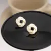 Pendientes Retro de Flor de Remolino Rojo Aceite Ankora Estilo Francés Suave Sencillo Moda Commuter Otoño e Invierno Pendientes Populares