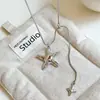 Colar retrátil de estrela prateada estilo indiferente para mulheres, corrente para clavícula com senso de design de nicho de luxo leve, acessório longo versátil para temperamento