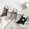 Calcetines Deportivos de Caña Alta para Mujer, Calcetines de Dibujos Animados de Alta Elasticidad, Calcetines de Algodón Peinado Todo en Uno Nai Fu Kelu Li Venta al por Mayor