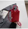 Bolso Tejido de Diseño Nicho Coreano para Mujer 2026 Nueva Moda Bolso Cruzado de Color Sólido Simple Bolso de Mano Pequeño Bolso para Teléfono Móvil