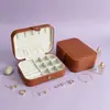 En stock cinturón de cuero PU caja de almacenamiento de joyas con espejo bolsa de accesorios estilo ins caja para collar largo anillo pendiente caja de tachuelas caja de exhibición