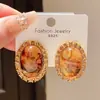 Brincos Ovais Geométricos Manchas de Resina com Diamantes Incrustados Agulha de Prata Retrô Francês Luxo Acessível High-End Niche Elegantes