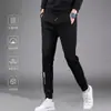 Envio RápidoCalças Grossas de Outono Masculinas com Zíper Lateral, Múltiplos Bolsos, Cintura Alta Elástica, Calças de Moletom com Caimento Solto, Calças Esportivas