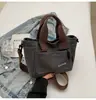 Bolso Minimalista Vintage para Mujer 2026 Nuevo de Moda Versátil Bolso para el Almuerzo Bolso Cesta de Nicho para Viajes Diarios