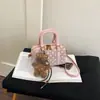 Bolso modelo nuevo 2026 transfronterizo, bolso tote pequeño para mujer, alto valor estético, bolso tipo almohada de lunares de nicho, bolso de hombro y cruzado para mujer