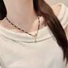 Collar con Borla de Espinela Negra de Tono Oscuro Retro de Gama Alta Estrella de Cinco Puntas Diseño de Nicho Cadena para Clavícula Versátil para el Viaje