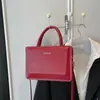 Bolso Cruzado Casual con Tapa abatible 2026 Primavera Nuevo Estilo Bolso de Mano Casual de Moda Simple de Color Caramelo Pequeño Cuadrado