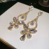 Novos brincos de agulha prateada estilo europeu e americano com diamantes, design de borboleta e gota d'água, toque de luxo leve e alta qualidade, brincos requintados e modernos para festas femininas