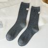 Calcetines apilados para mujer, de tubo medio, Zhuji, para primavera y otoño, de algodón, de color liso, con etiqueta de tela de doble aguja, sin hueso, calcetines lunares, blancos, combinables.