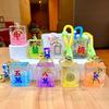 Creativo aceite acrílico luminoso mahjong llavero botella de arena movediza colgante de pareja muñeco máquina de garras regalo al por mayor