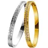 Pulseira de Aço Titânio Novo Estilo Que Não Desbota, Toque de Alto Padrão para Mulheres, Banhada a Ouro em Forno, Exquisite Pulseira de Aço Inoxidável Europeia e Americana