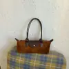 Bolsa Feminina Baguete de Ombro para Axila Estilo Francês Niche Camurça Veludo Moda Luxo Leve Bolsa de Ombro Único para Axila Versátil para Comércio Exterior