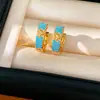 Aretes redondos de flor tachonados con circonia, chapados en oro real de 18k, aretes de nicho modernos y únicos con un toque de lujo ligero y de alta gama.
