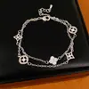 Pulseira redonda de camada dupla com flor de trevo de zircônia banhada a ouro real, pulseira de pulso de nicho de luxo leve, joia feminina personalizada e estilosa