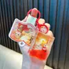 Yiwu Love Botella de Aceite y Arena Magnéticos para Refrigerador Llaveros Juguetes Colgantes Lindos Flotantes Pequeños Regalos Al Por Mayor