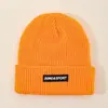 Gorro de Tela Tejida Gruesa con Etiqueta para Hombres y Mujeres Otoño e Invierno 2025 Nuevo Gorro de Lana Tejida Gorro Cálido de Invierno con Protección para los Oídos Gorro para el Frío