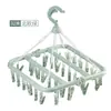Colgador de plástico plegable giratorio directo de fábrica para el hogar, a prueba de viento, tendedero para calcetines, multi-clip, colgador interior, venta al por mayor