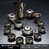 Juego de té de arcilla púrpura con diseño de bambú dorado, que incluye una tetera y tazas de servicio para uso doméstico, con un asa para prevenir quemaduras y asegurar la distribución uniforme del té