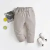 Pantalones Elásticos Transfronterizos para Niños y Niñas Conjunto Primavera y Otoño Pantalones Modernos Frescos y Atractivos Uniforme Escolar Casual