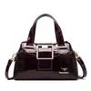 Bolsa feminina 2024 nova bolsa para mulheres de meia-idade simples atmosfera bolsa de ombro mensageiro moda comércio exterior portátil bolsa de mãe atacado