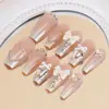 Set de 10 Piezas de Uñas Postizas Premium Hechas a Mano con un Look Sofisticado, Presentando Moños 3D, Cadenas de Pedrería y Diseño Ojo de Gato