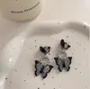 Aretes de Mariposa Negros ~ Dulces y Frescos Diseño de Nicho Ins 2025 Nuevos Aretes Retro para Mujer Accesorios de Oreja de Moda Clips para Orejas