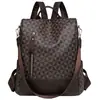 Atacado para comércio exterior: Nova mochila feminina estilo coreano 2026 de couro macio antifurto, bolsa de uso duplo da moda com blocos de cor para viagens ao ar livre