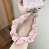 Correa de muñeca nueva original para otoño/invierno con un patrón de estrella de jacquard, diseño trenzado hecho a mano, doble hebilla y cadena anti-pérdida para teléfono