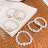 Anillo de pelo de perla de alta calidad, cuerda para el cabello, banda de goma pequeña coreana simple, pulsera para el cabello, cuerda para el cabello de doble propósito, accesorios para el cabello al por mayor