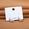 Pendientes de diseño de nicho de moda de alta gama, elegantes y versátiles pendientes de botón florales para mujer, accesorios para la oreja de lujo ligero de moda al por mayor