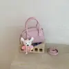 Bolsa Doce e Simples Primavera 2026 Estilo Coreano Cor Sólida Bolsa de Ombro Único Transversal Estilosa Design de Nicho Bolsa de Mão Concha