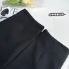 Pantalones Cortos Negros 'Hot Girl' de Tres Cuartos para Mujer, Nuevo Estilo Otoño e Invierno 2026, Esenciales para Salir, Pantalones Casuales con Cremallera en el Dobladillo, Pantalones Cortos Versátiles 'Hot'