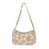 Bolso de axila nuevo estilo coreano, bolso de hombro con cadena de camelia de moda, tendencia primavera-verano para mujer, versátil y elegante para ir al trabajo