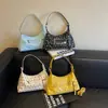 Textura de nicho color retro bloque de color lunares 2026 otoño nuevo elegante simple gran capacidad versátil bolso de hombro cruzado