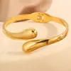 Pulsera de titanio con tendencia de moda europea y americana transfronteriza, gota de agua, línea aerodinámica, textura de metal exagerada, pulsera suave de abrazo, joyería