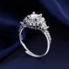 Versión coreana de un anillo de bolso redondo de pétalos de alta gama de 1 quilate con voz vibrante y temperamento en vivo, anillo de diamantes de imitación Mosan para mujer, suministro directo de fábrica.