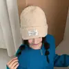Al por mayor 25 Años Otoño e Invierno Nuevo de Alta Calidad Color Sólido Parche Circunferencia de Cabeza Grande Gorro de Punto Casual Cálido y a Prueba de Frío Gorro de Lana