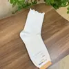 Calcetines de Algodón para Mujer de Primavera Temprana Color Sólido con Volantes de Longitud Media Importados de Dongdaemun Kikiya Corea Venta al por Mayor