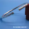 Pulsera de aro con dijes de venta caliente en puesto Pulsera de aro dorado Pulsera de pareja aguja divina Dinghai