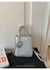 Bolso de diseñador único para mujer, nuevo bolso cruzado versátil de verano 2026, bolso de mano súper popular para ir al trabajo, bolso cuadrado pequeño
