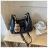 Bolsa feminina grande capacidade estilo coreano, novo modelo outono 2026, bolsa de ombro e transversal lisa e moderna, bolsa de bolinho casual para o trabalho