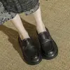 Zapatos Negros de Cuero Vintage 2026 Modelo Nuevo Punta Redonda Hebilla Metálica Estilo Universitario Corte Profundo Zapatos Individuales para Mujer con Suelas Gruesas y Tacones Gruesos Mocasines