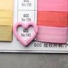 Color de pintura hebilla de resorte de aleación en forma de corazón anillo de resorte abierto llavero para auriculares colgante de equipaje accesorios de bricolaje