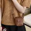 Mini Bolso de Color Sólido Estilo Coreano para Mujer 2026 Primavera Nueva Moda Elegante Bolso Silla de Montar Ligero Versátil Bolso para Auriculares