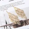 Brincos mais vendidos do Cross-border Wish: Moda europeia e americana, brincos longos de folha oca em camadas simples para mulheres